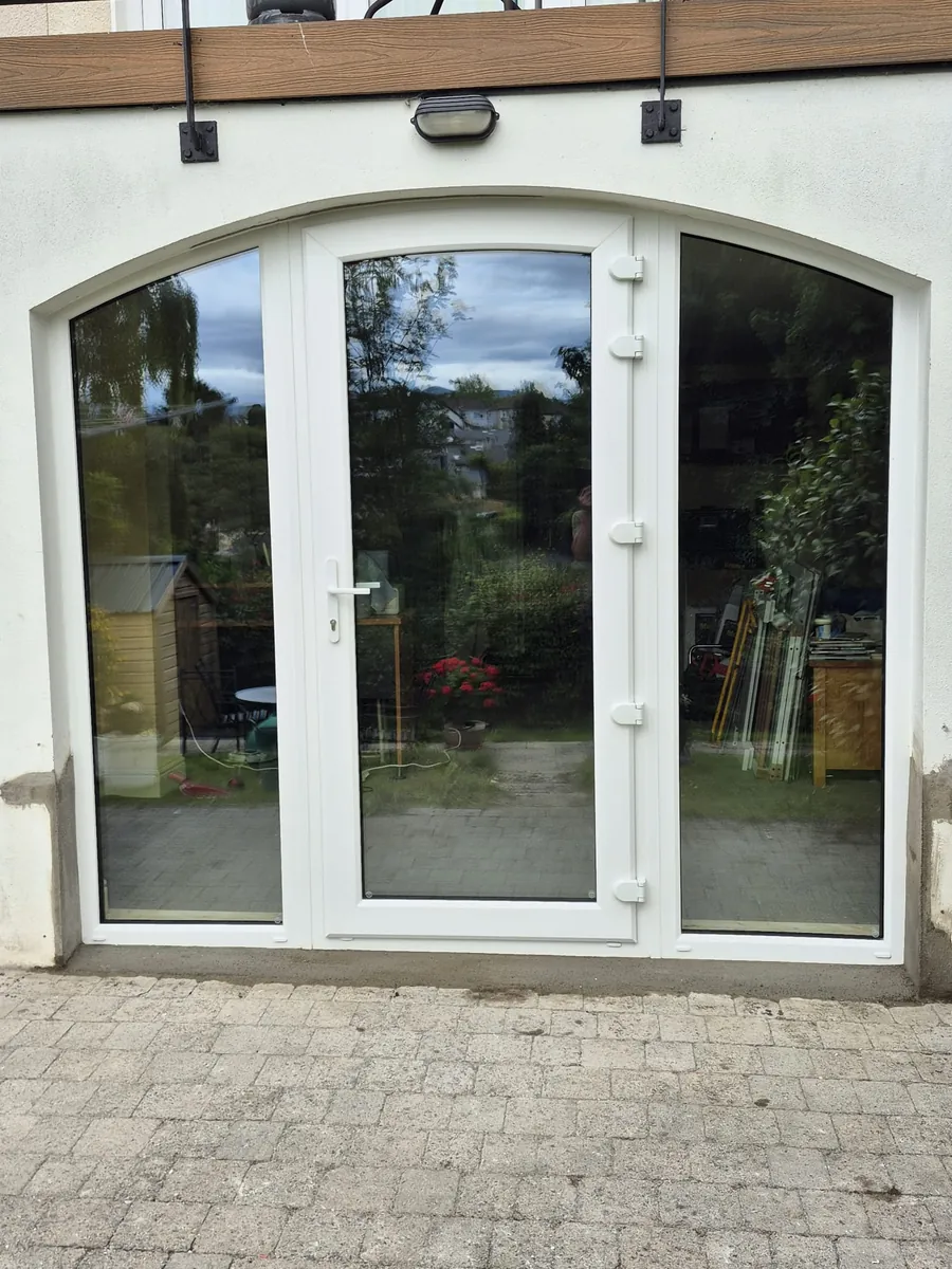 Arched uPVC door replacement in Co. Wicklow — new door with sidelights after